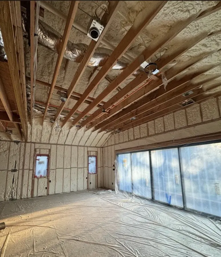 Interior walls and ceiling insulated with spray foam during new construction in Jordan
